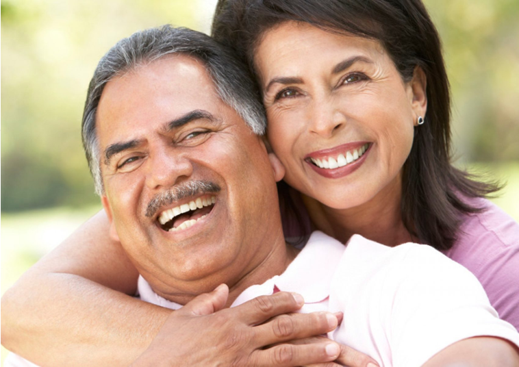 A smiling couple enjoying time together at home